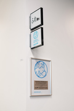 Sign that highlights baby feeding room, accredited by UNICEF